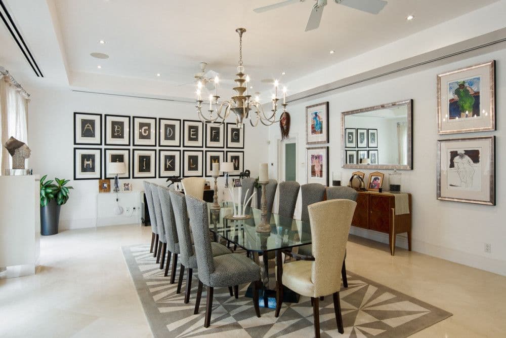 Formal dining room with a long glass table seating twelve at The Ridge