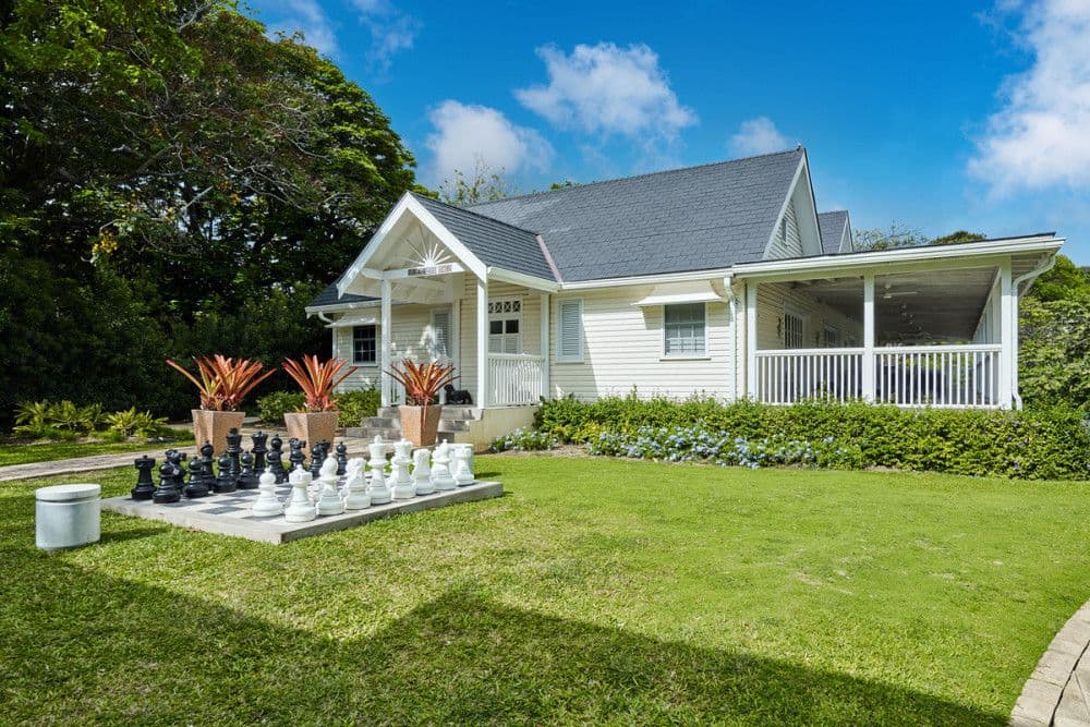 Timber Gingerbread House and a giant garden chess board in the grounds of The Ridge
