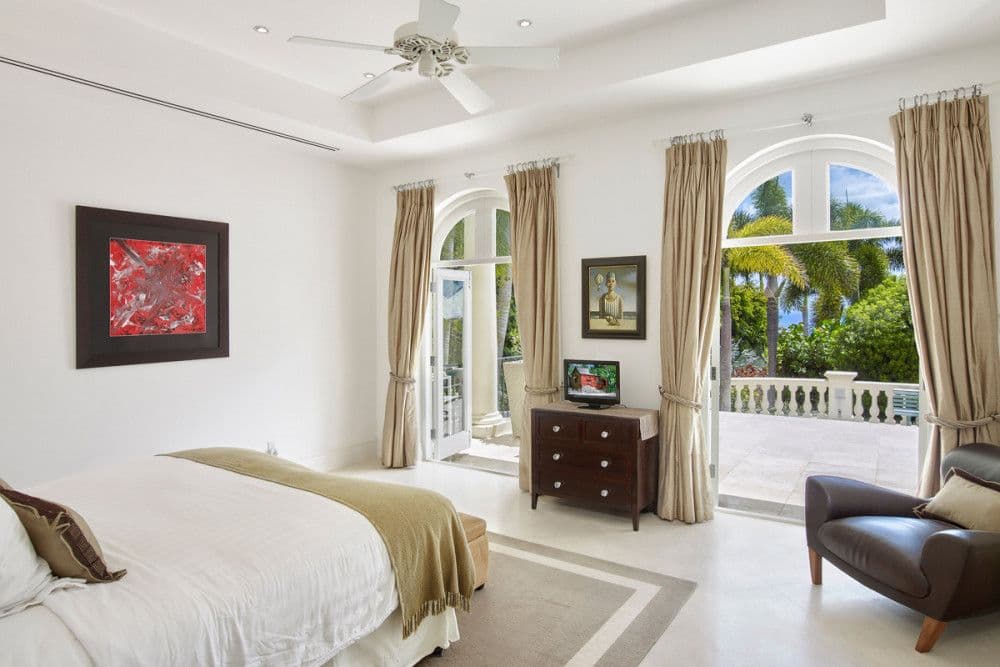 Guest bedroom with a king bed and soft neutral tones at The Ridge