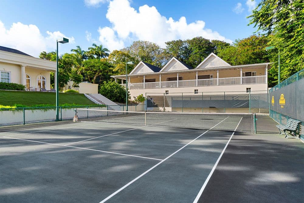 Private floodlit tennis court with a pavilion at The Ridge
