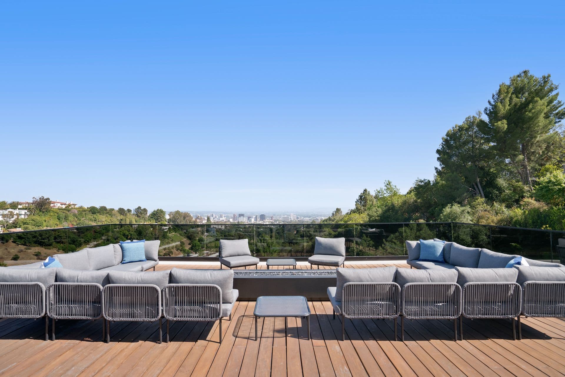 Rooftop deck lounge looking over Los Angeles to the ocean at Bel-Air Oasis