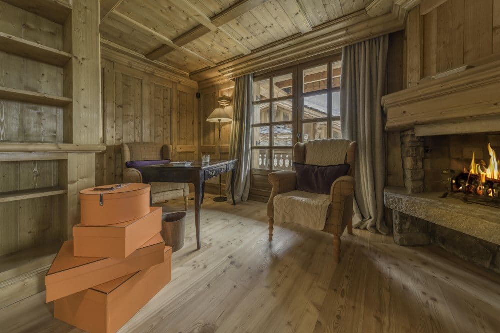 Bedroom with its own fireplace and mountain view at Courchevel 13