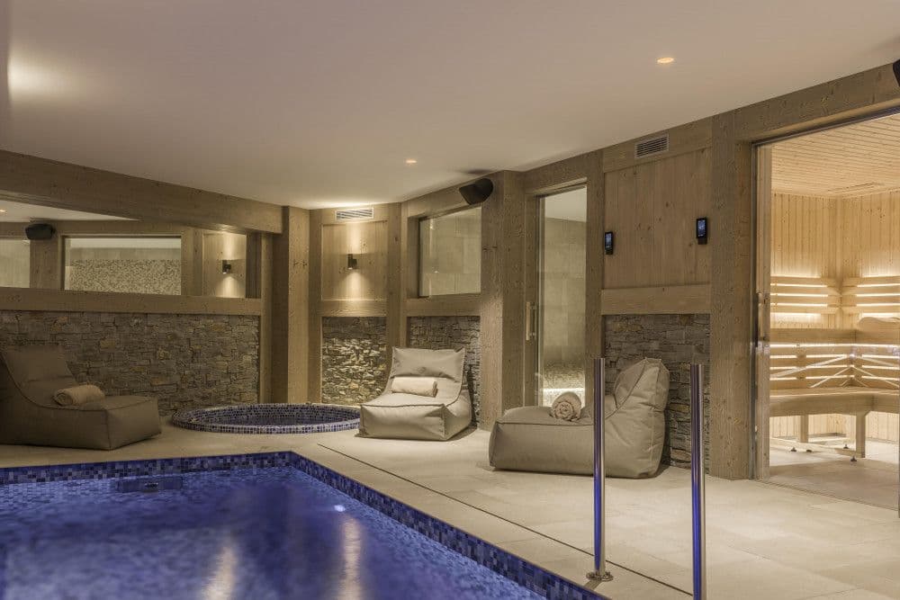 Indoor pool with a jacuzzi and sauna at Courchevel 13
