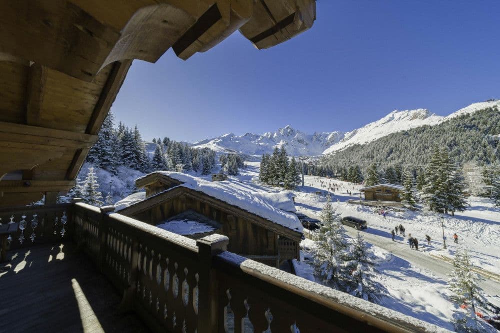 Balcony terrace overlooking the pistes and peaks at Courchevel 13