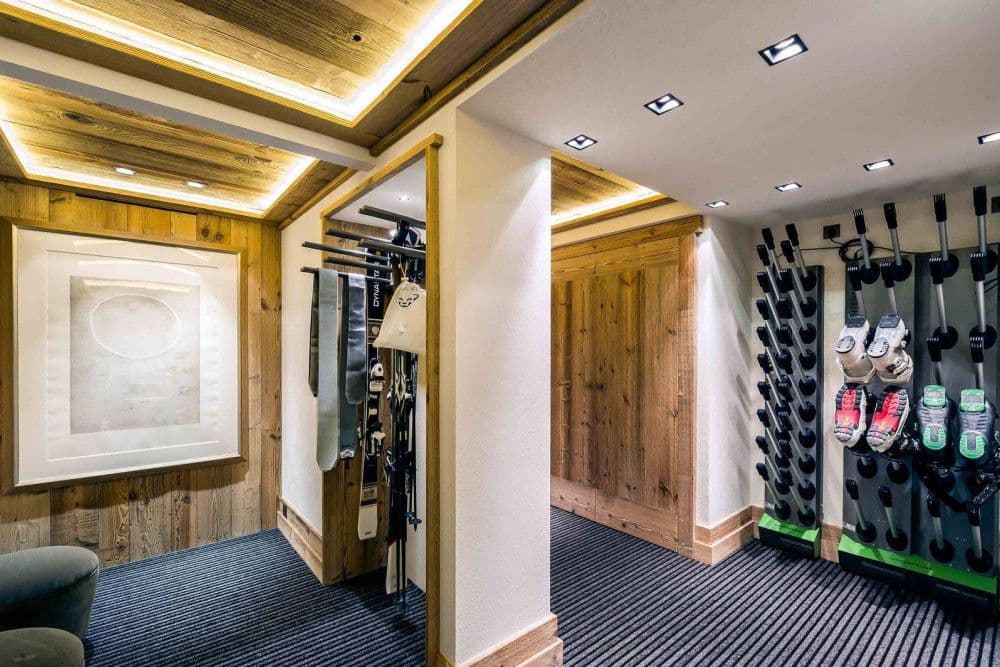 Ski room with boot warmers and racks at Courchevel 17