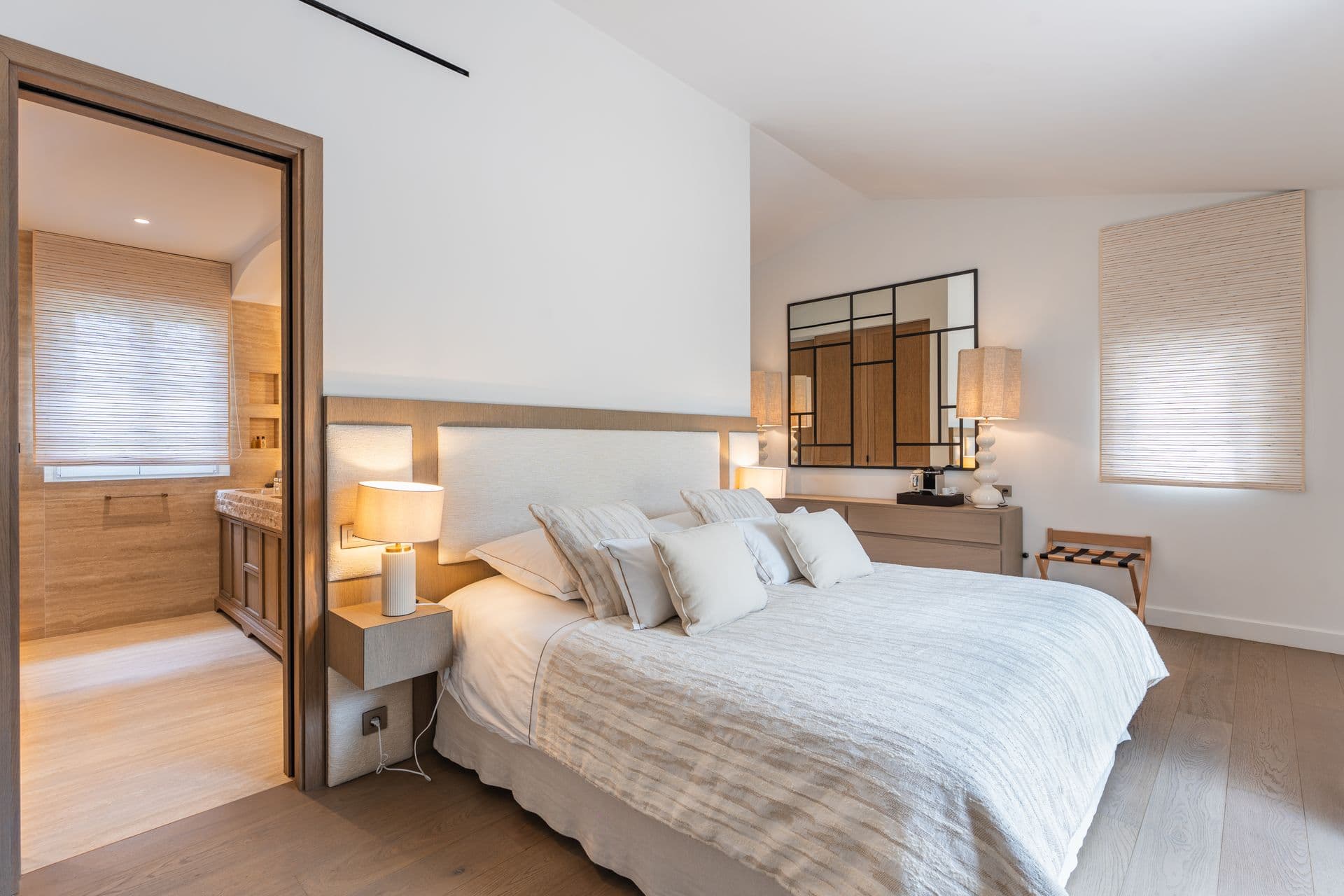 Bedroom with a private hallway leading to its ensuite.