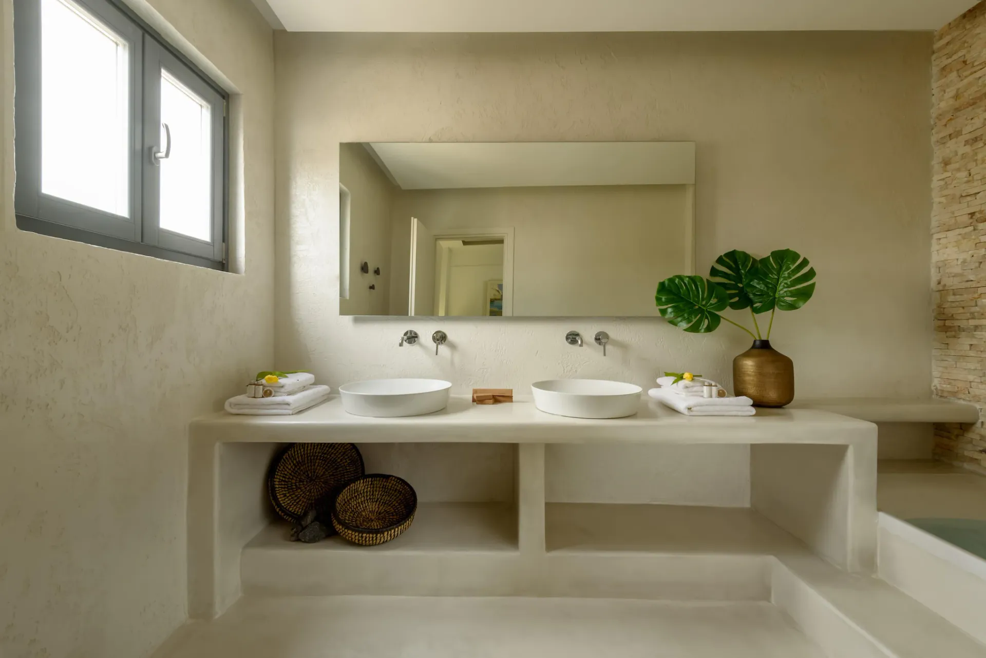 Double vanity bathroom at Gaia's Rest with stone finishes.
