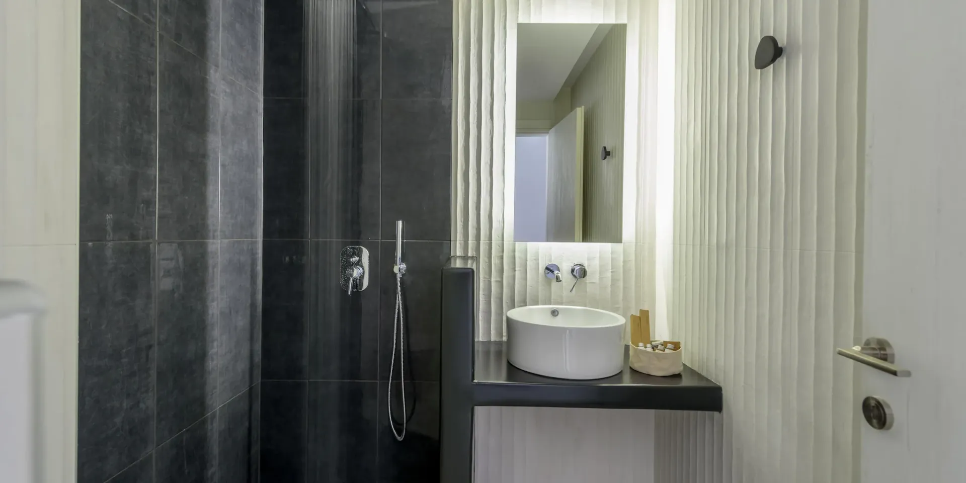 Dark tiled shower room at Gaia's Rest.