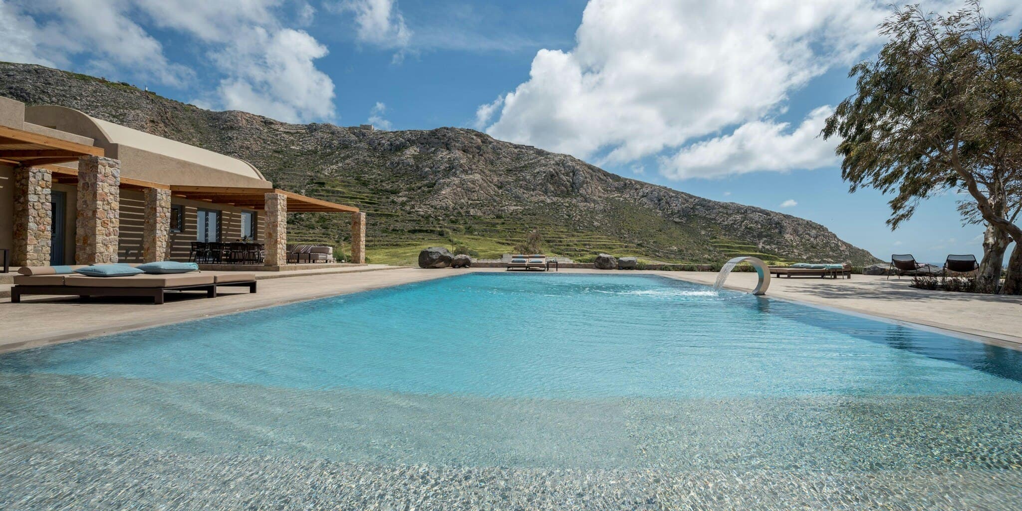Gaia's Rest curved infinity pool with mountain views, Santorini, Cyclades Islands, Greece