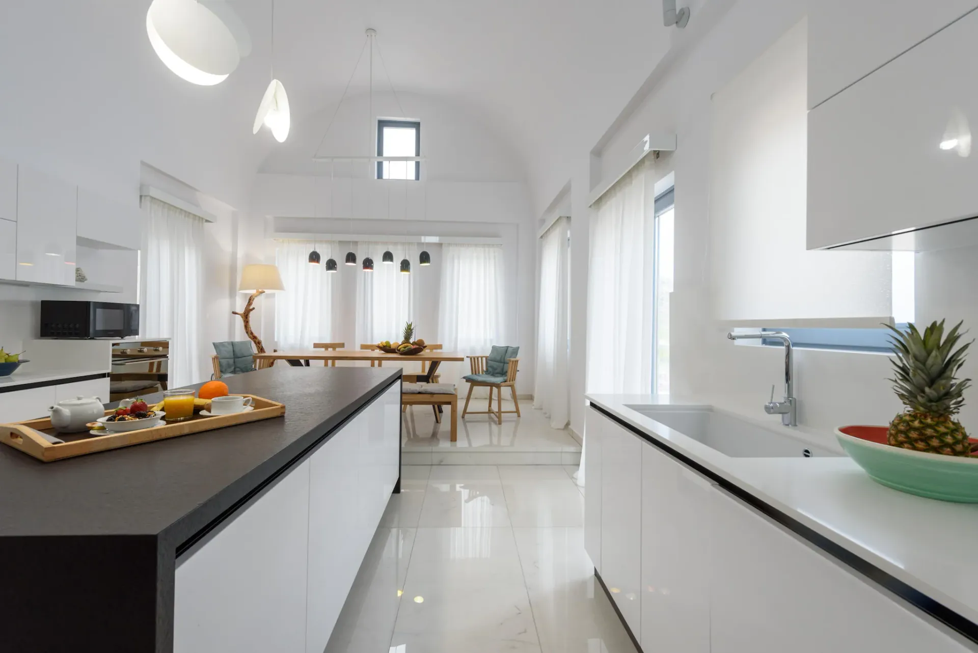 Kitchen island at Gaia's Rest with marble worktops and bar seating.