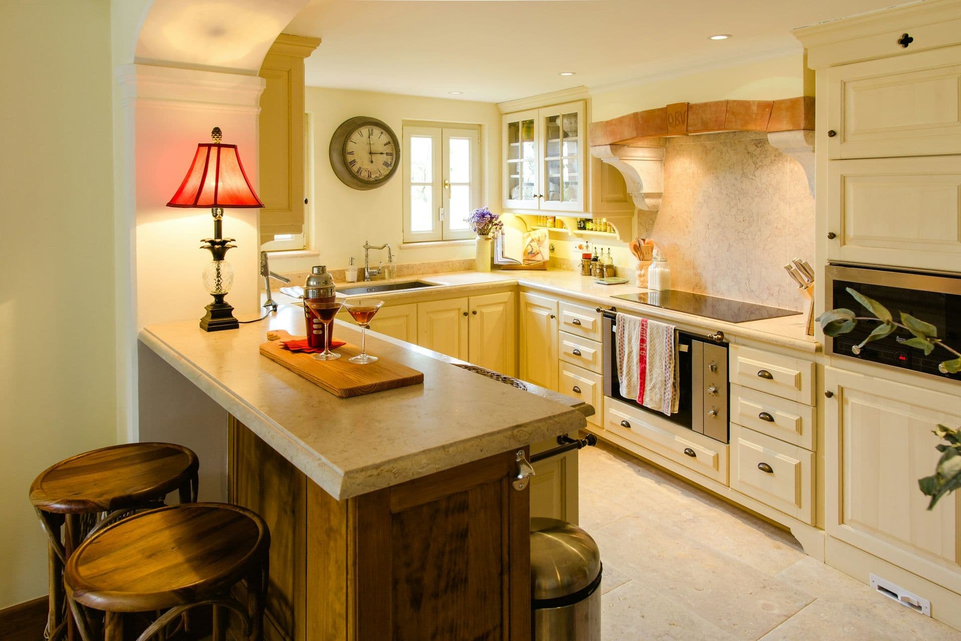 Cream country kitchen with an island and range at Romantic Outlook, Sintra