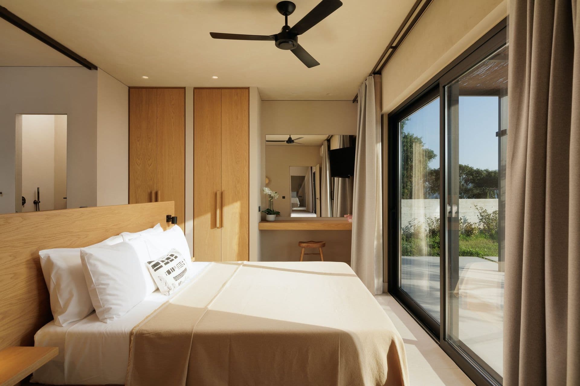 Double bedroom with an oak headboard and en-suite at Corfu Dreams, Corfu