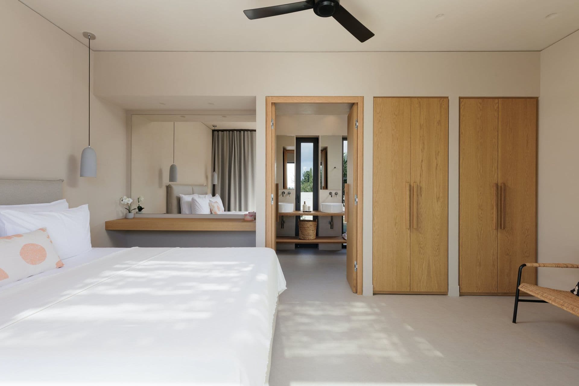 Master bedroom in cream with a ceiling fan and en-suite at Corfu Dreams, Corfu