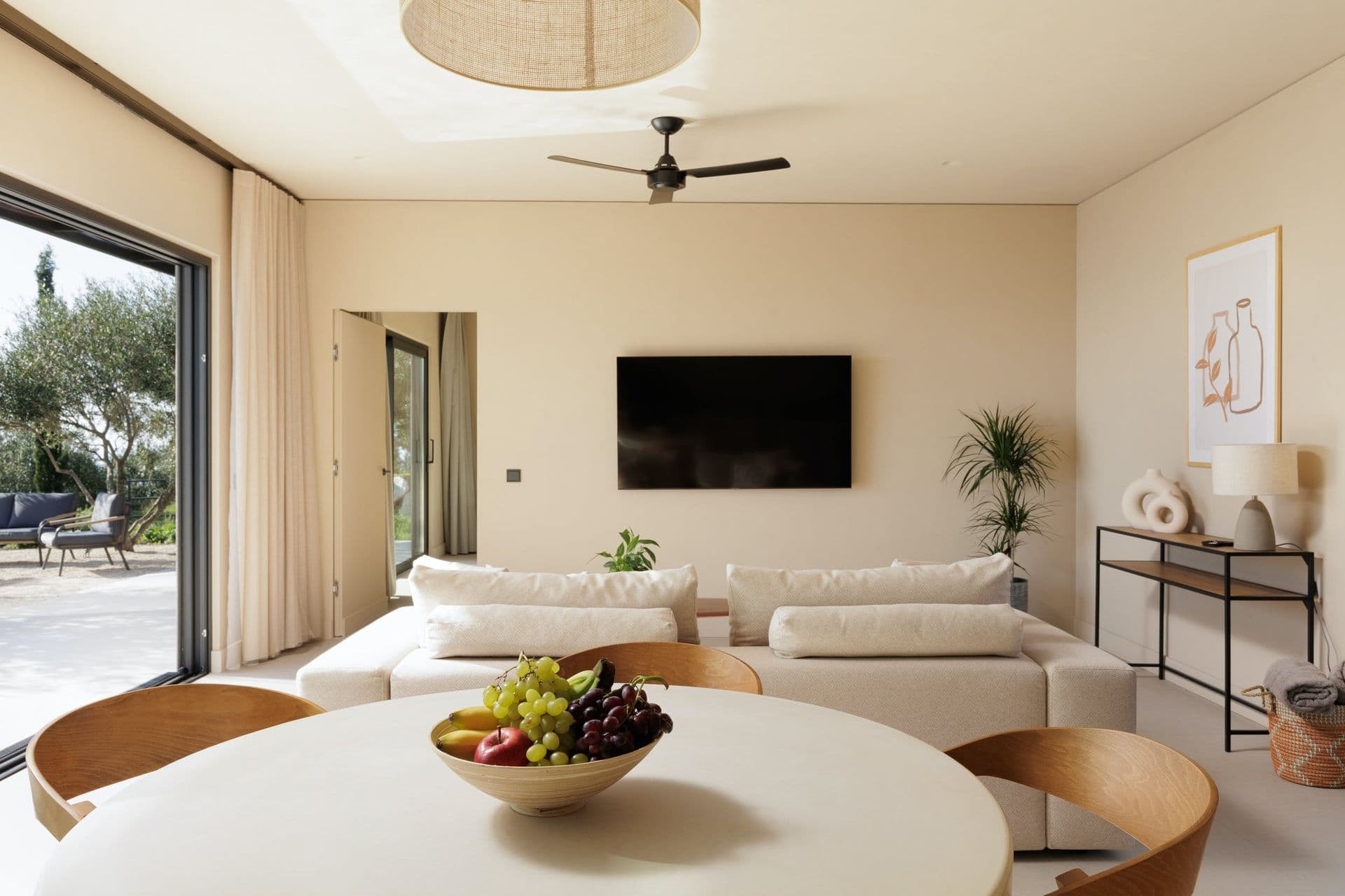 Open-plan living and dining area in soft neutrals at Corfu Dreams, Corfu