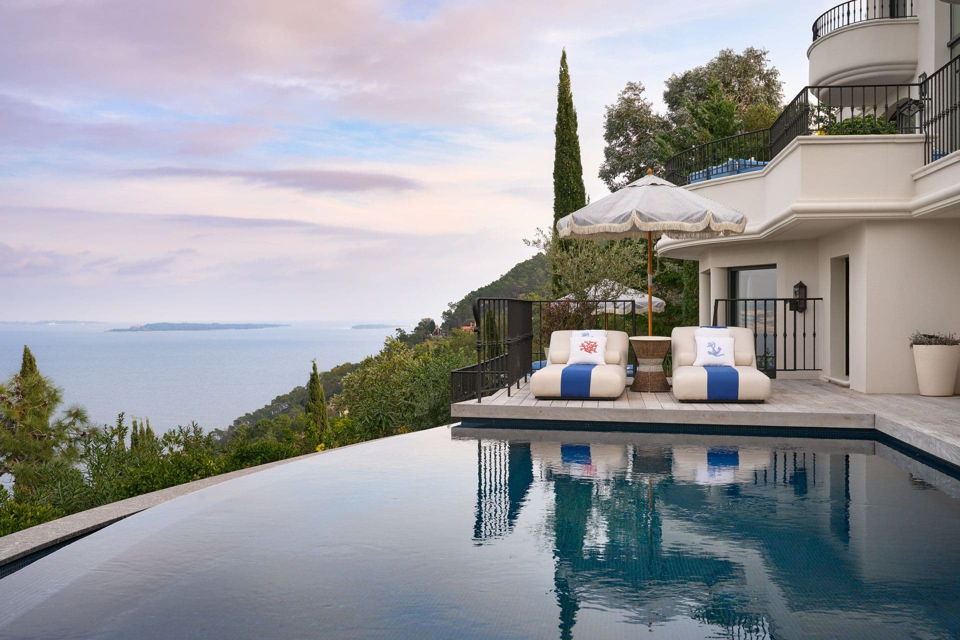 An infinity pool merging with sweeping sea views from the villa's terrace