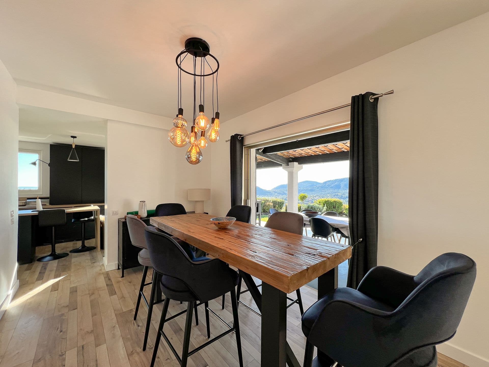 Dining area with a wood table and pendant lighting at Southern Beauty