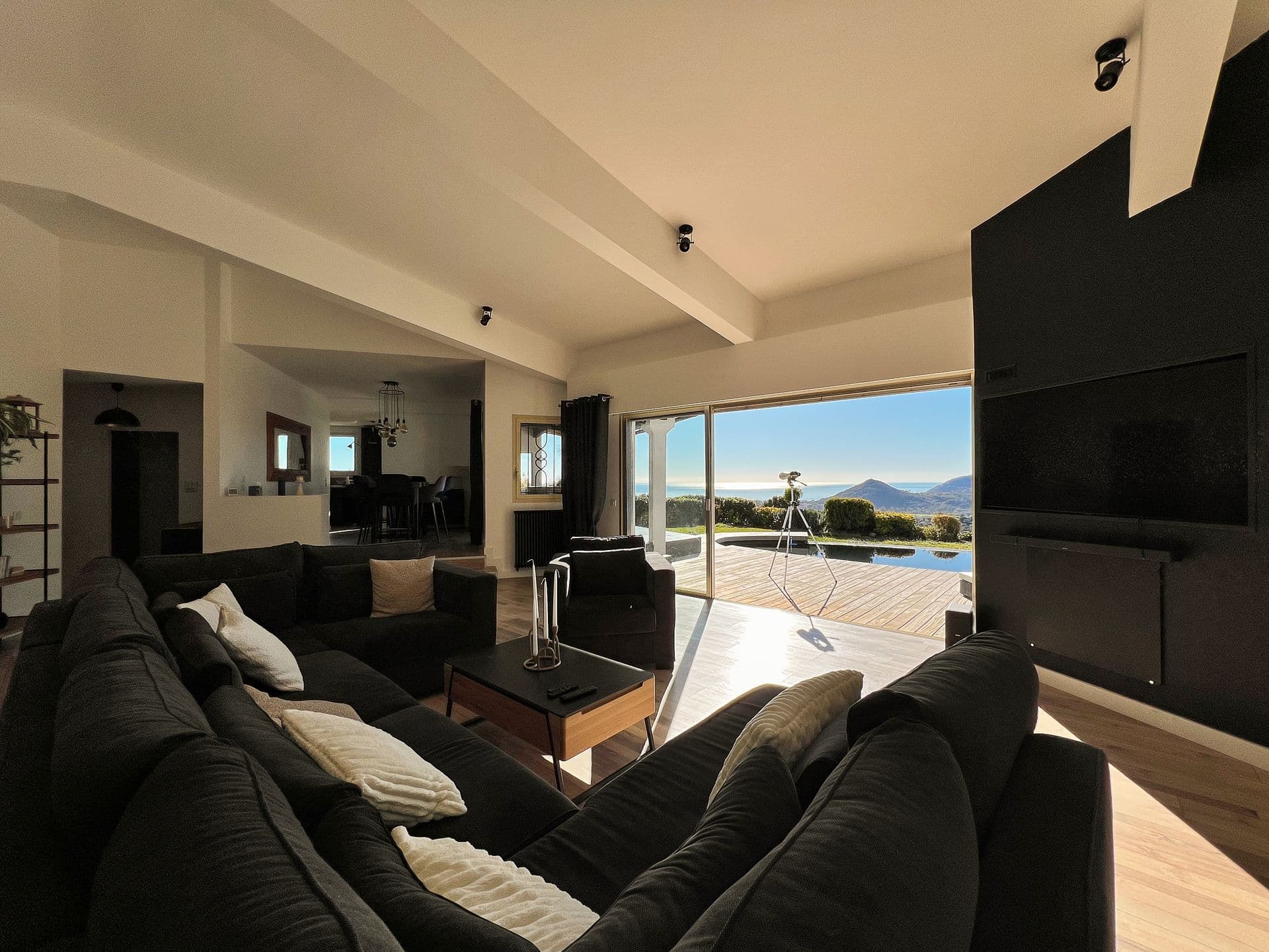 Living room with sectional sofa and panoramic hillside views at Southern Beauty