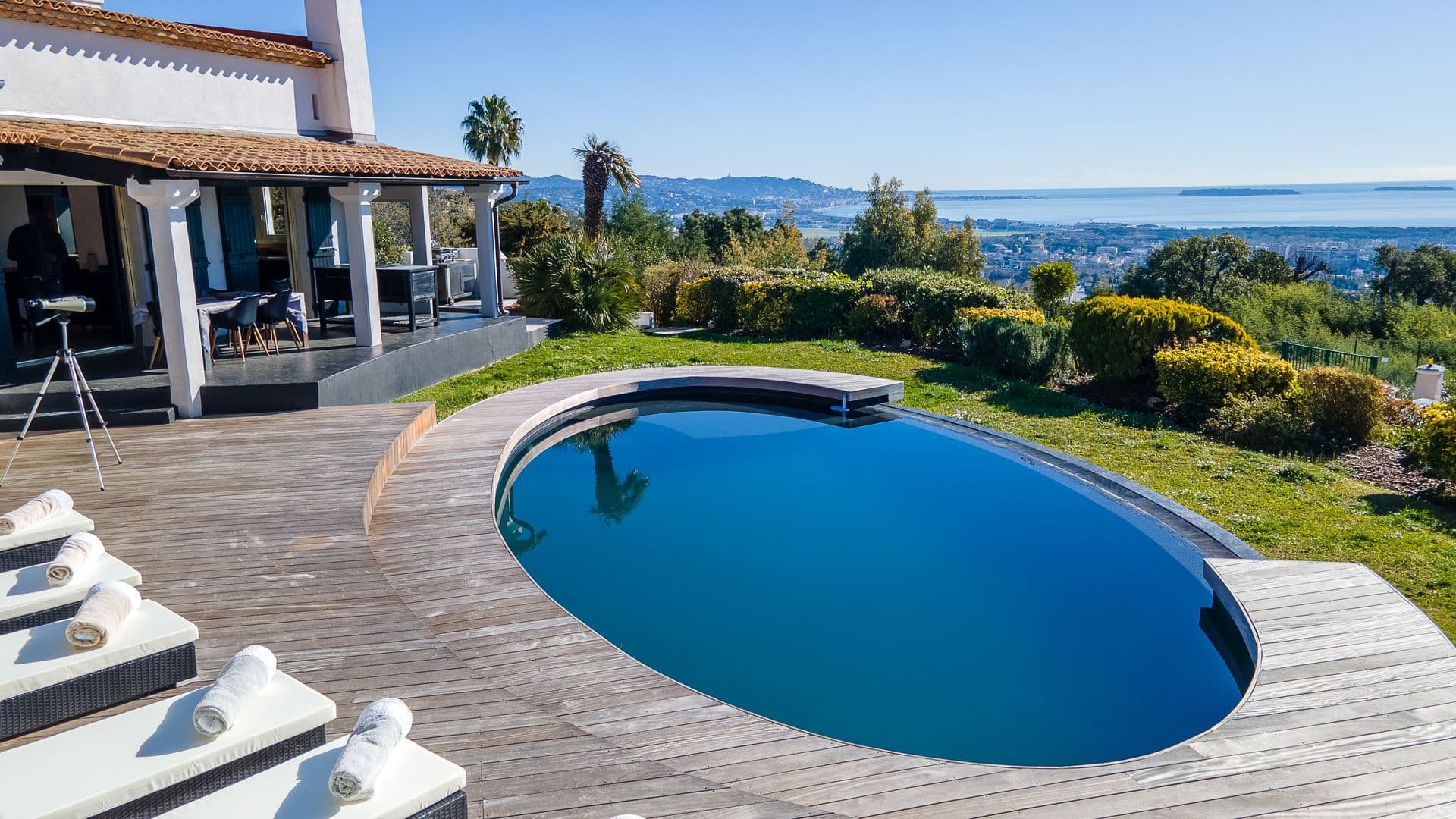 Sun terrace with loungers and a distant sea view at Southern Beauty