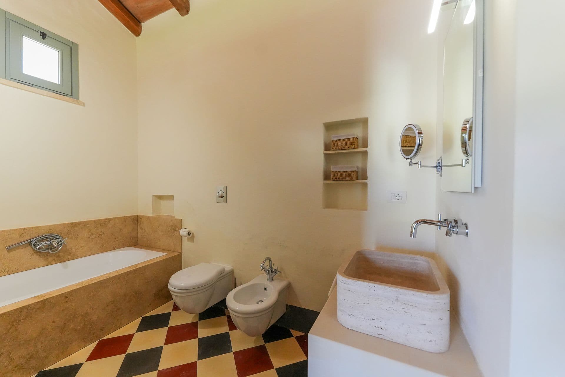 Bathroom with freestanding tub and checkered floor at Puglian Farmhouse