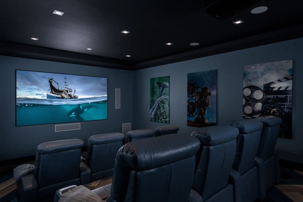 Home cinema with tiered recliner seating at Seaclusion