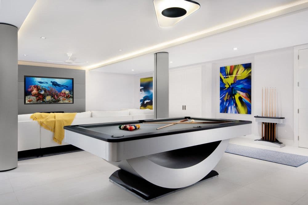 Games room with a sculptural billiards table at Seaclusion