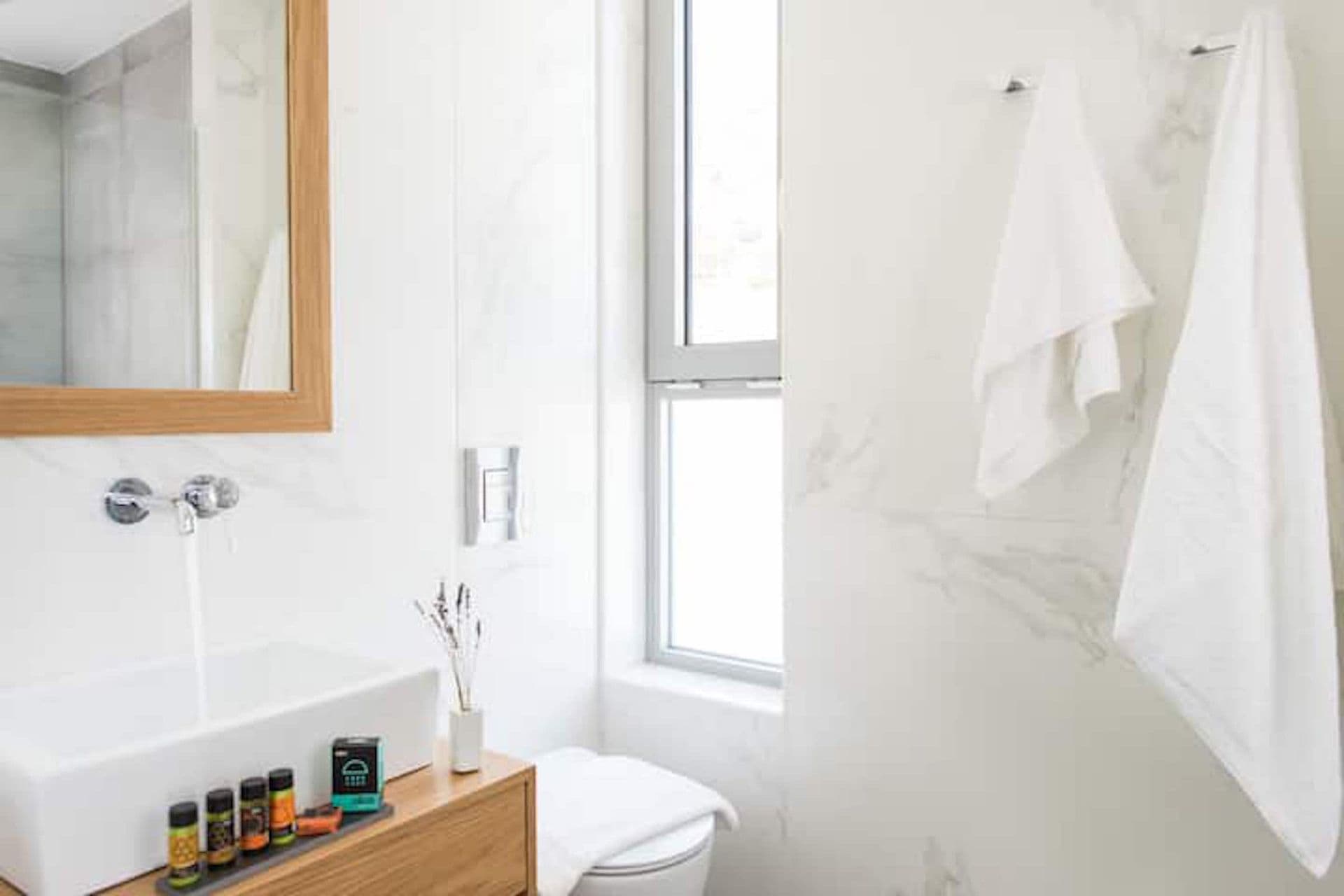 Bright marble shower room with a vessel basin at Back to the Sea, Greece