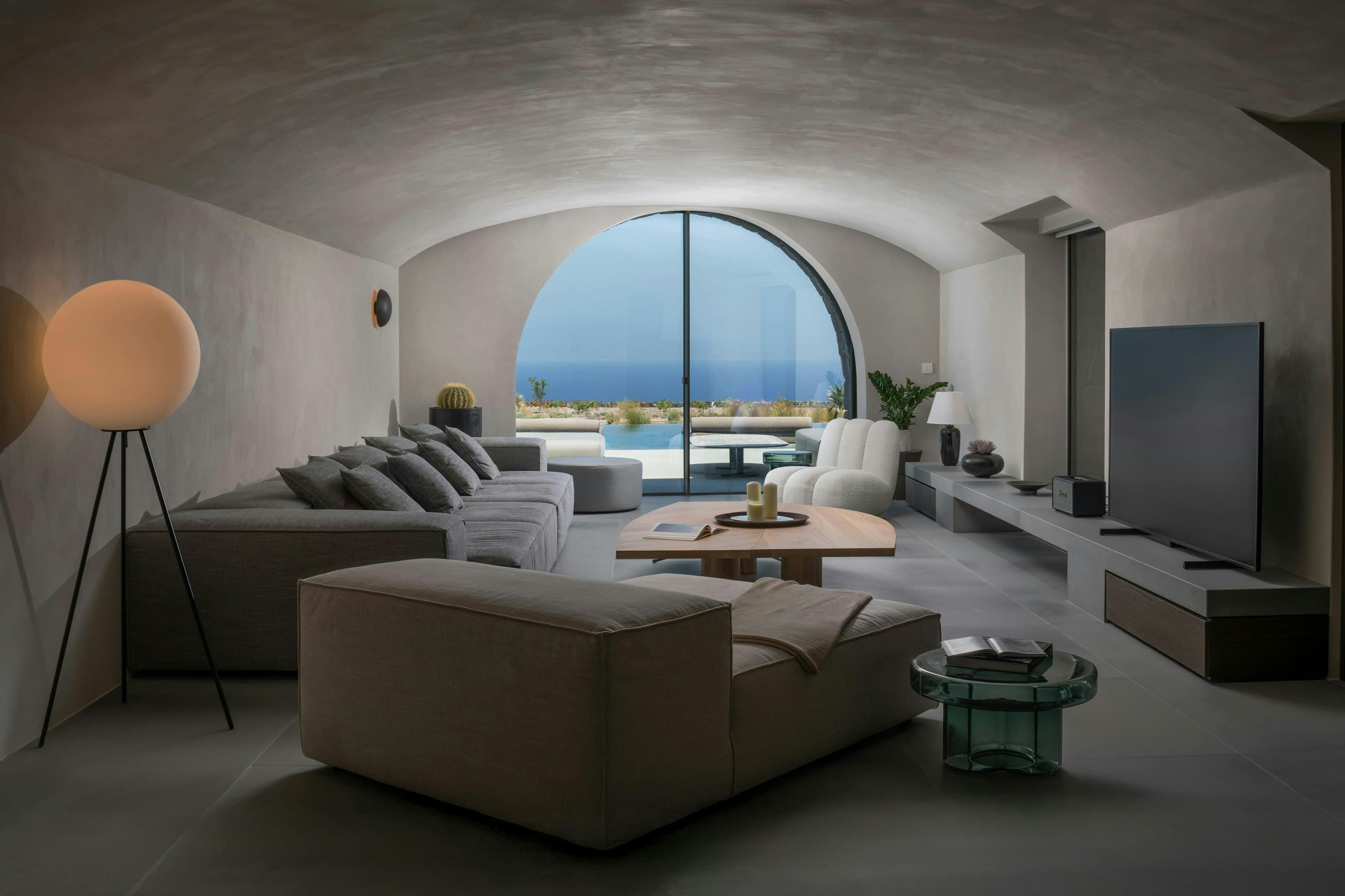 Earth Haven living room with barrel-vaulted ceiling and sea views, Oia, Cyclades Islands, Greece