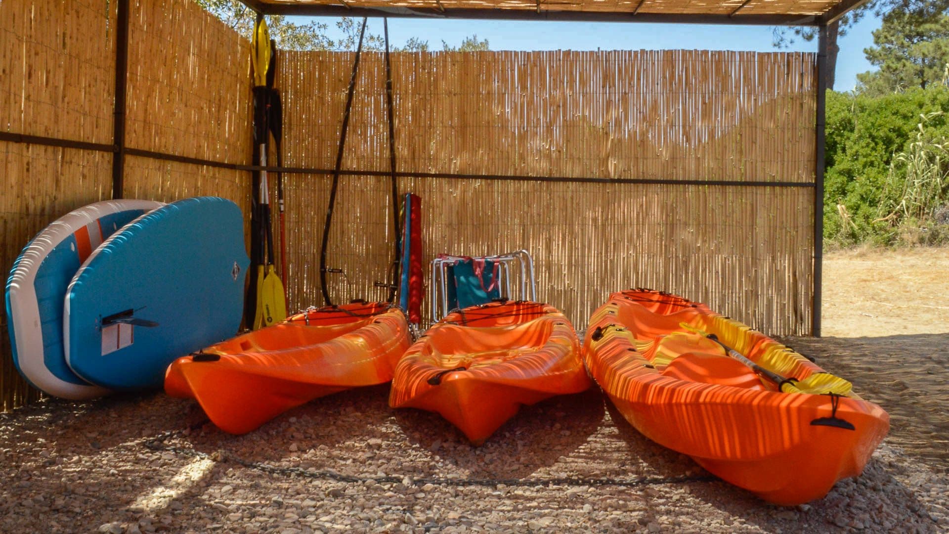 Kayaks and paddleboards stored ready for exploring the surrounding lagoon