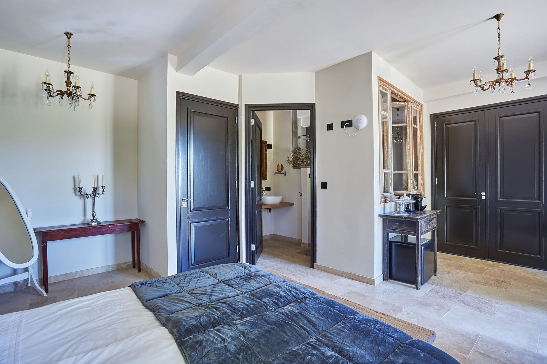 En-suite bathroom with a walk-in shower and stone basin off the master bedroom at A Glass of Champagne, Provence