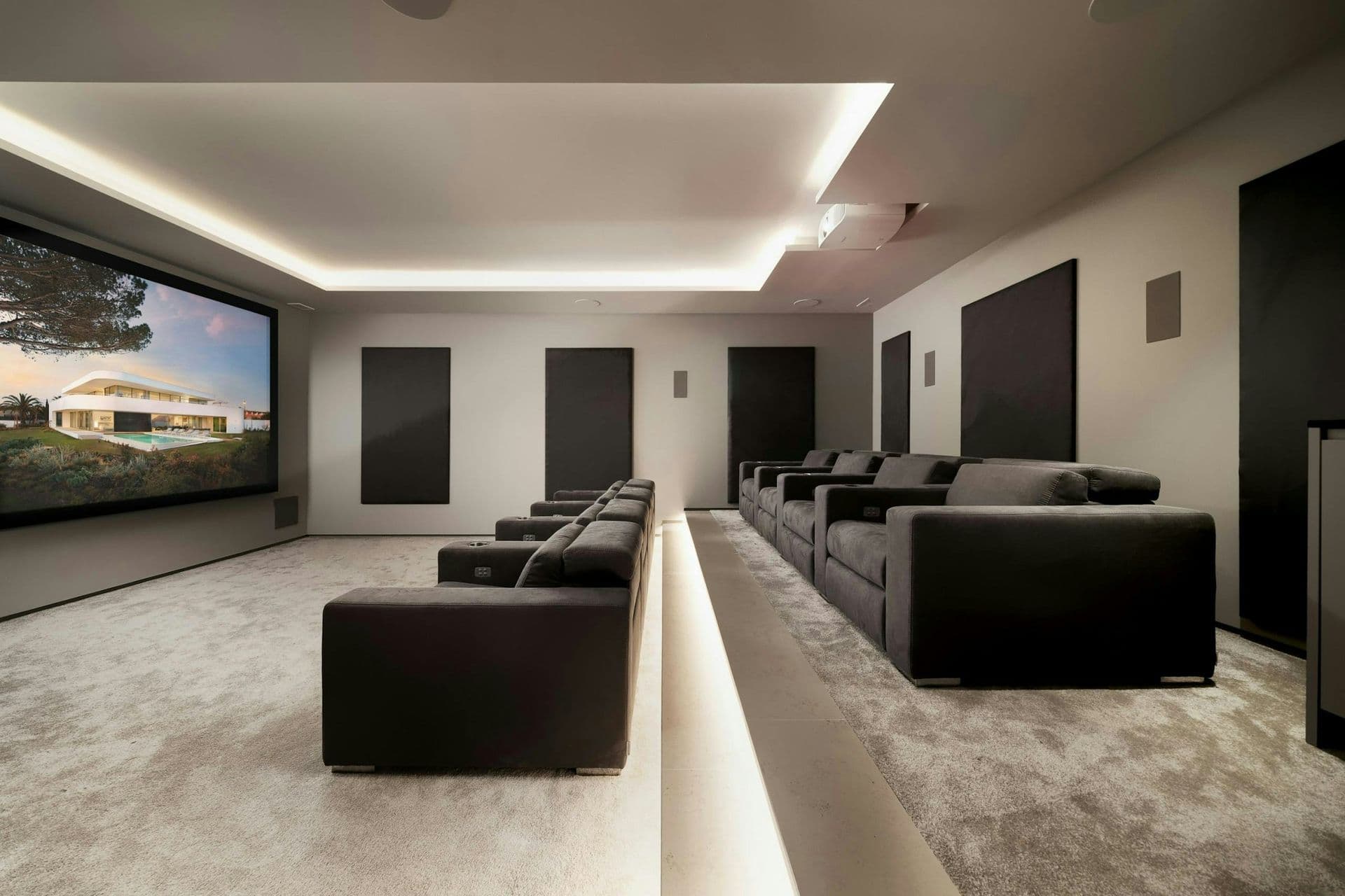 Home cinema room with tiered seating at A Coastal Crown, Lagos
