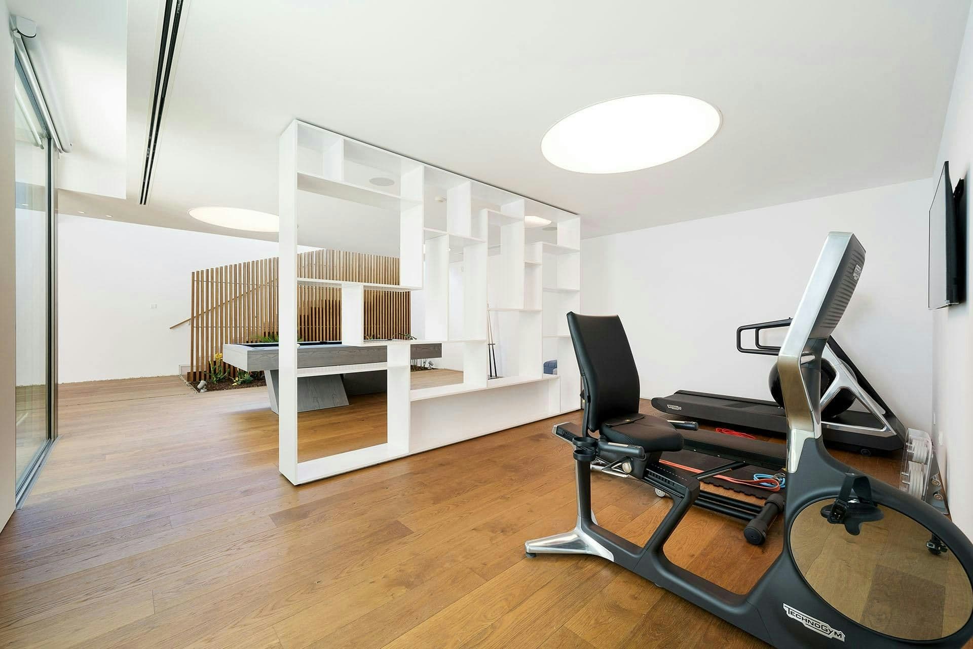 Home gym with cardio equipment at A Coastal Crown, Lagos