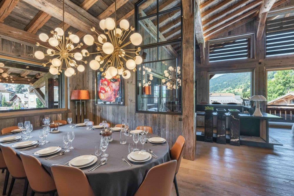 Dining area under the double-height barn roof at Megeve Centre 7