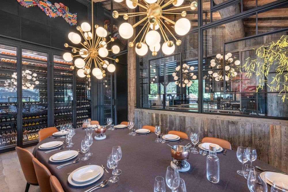 Glass-walled wine cellar beside the dining room at Megeve Centre 7