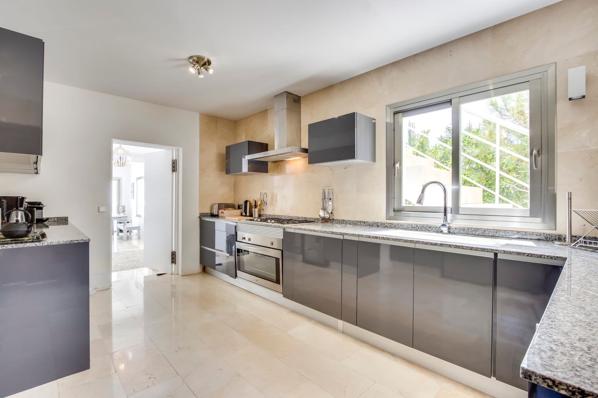 Modern grey kitchen with stainless steel appliances