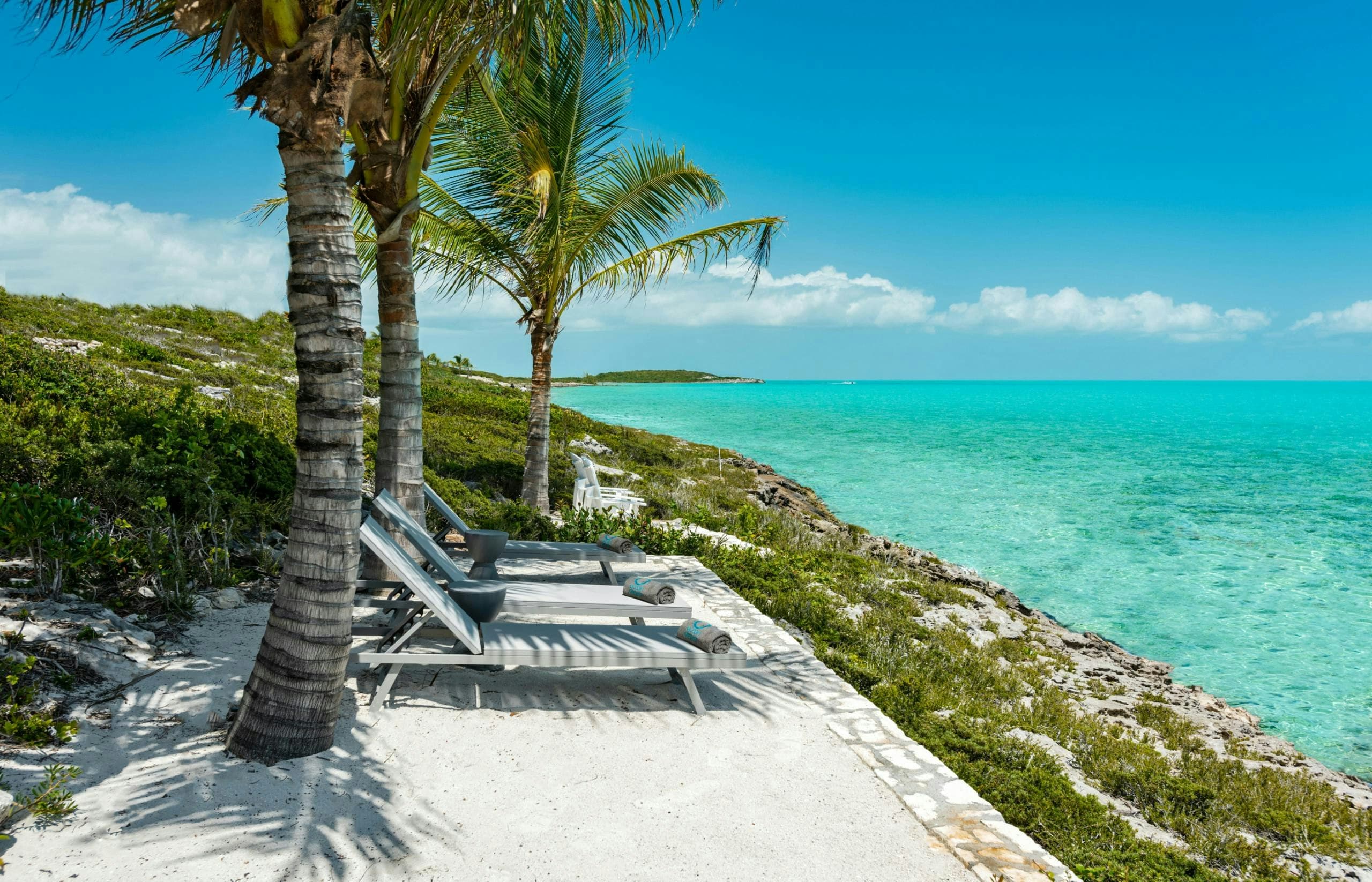 Atlantic Ocean Retreat beachfront terrace with sun loungers, Leeward Settlement, Turks and Caicos Islands