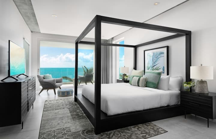 Atlantic Ocean Retreat master bedroom with canopy bed, Leeward Settlement, Turks and Caicos Islands