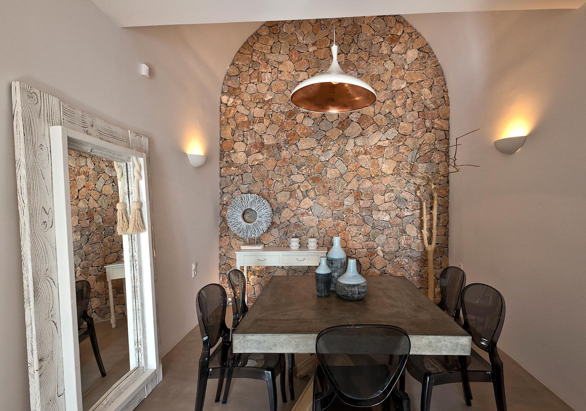 Dining table set beneath a stone archway at Grecian Gazing