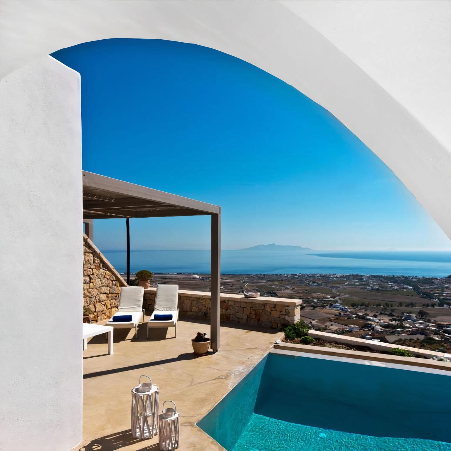 Shaded pergola terrace beside the pool with distant sea view at Grecian Gazing