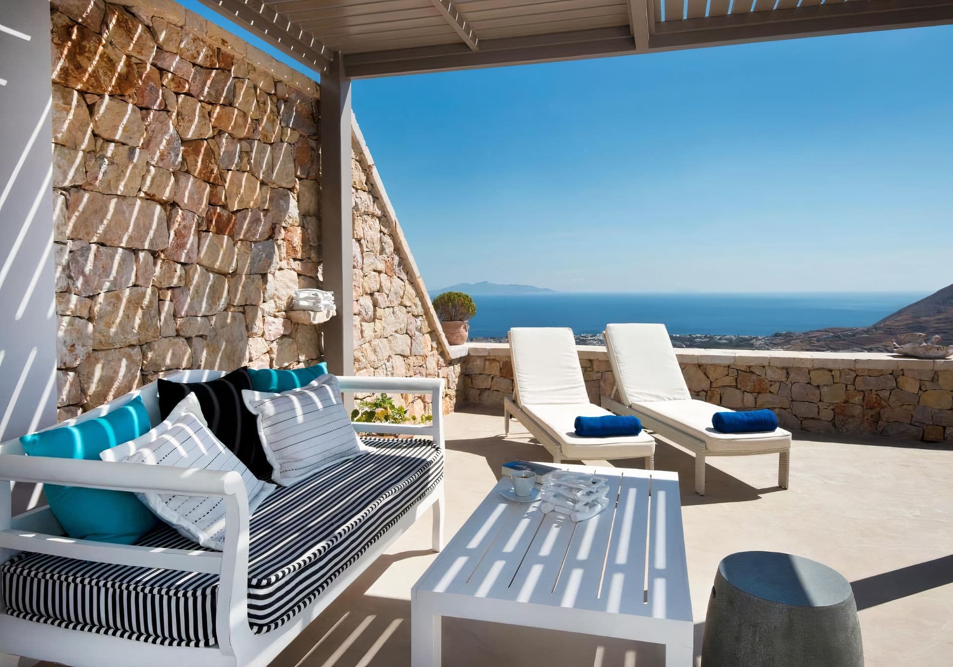 Cosy sitting nook with striped daybed cushions at Grecian Gazing