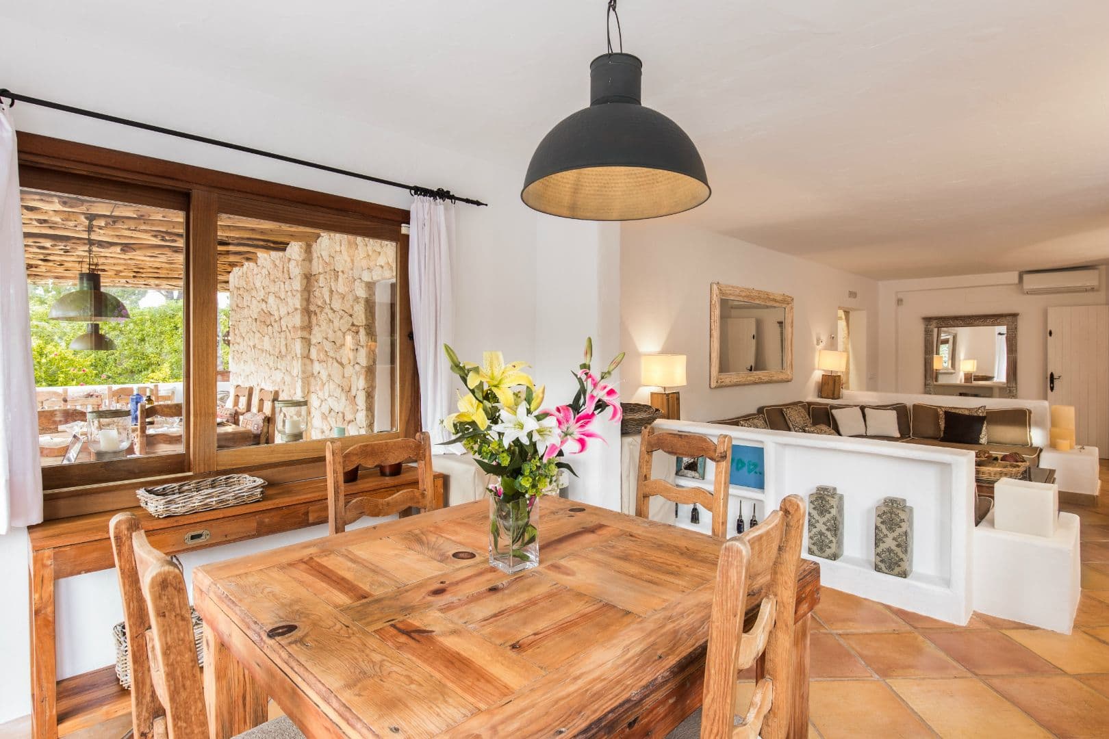 Dining table beside the open kitchen pass-through