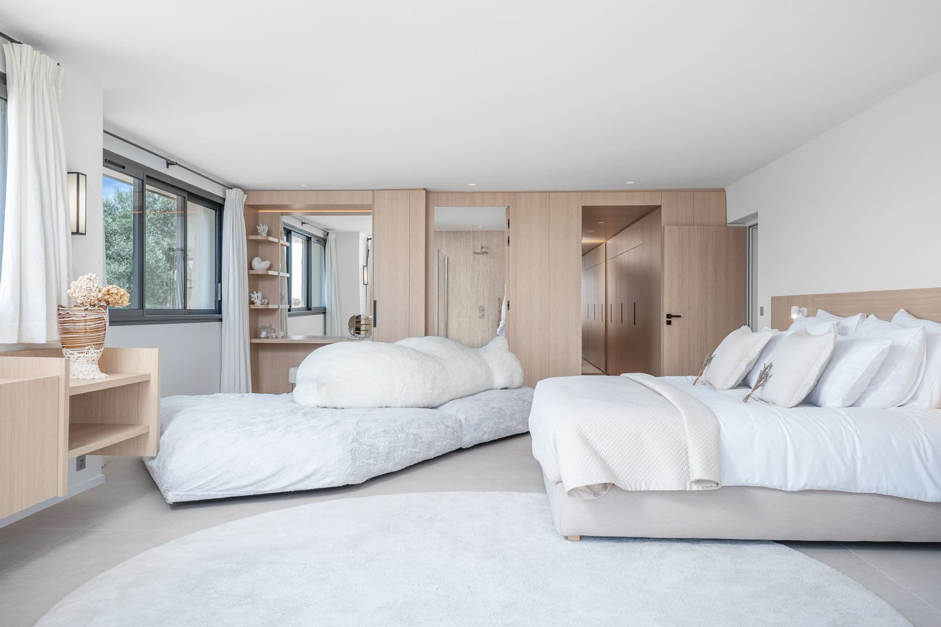 Bright double bedroom in oak and white with a dressing area at Alpilles Retreat, Provence