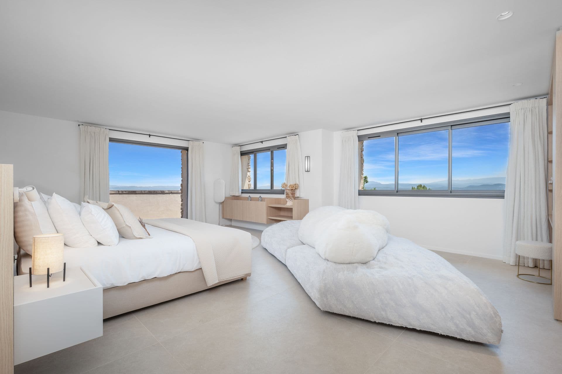 Master bedroom with twin picture windows over the valley at Alpilles Retreat, Provence