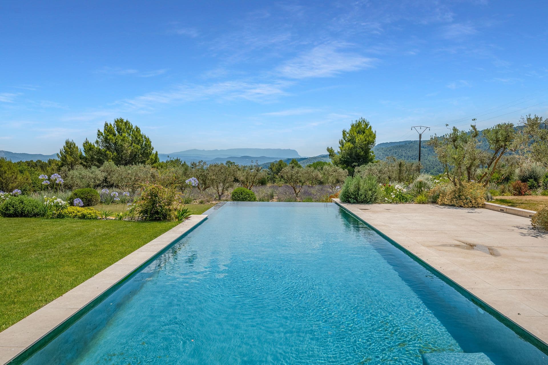 Infinity pool looking out over the Provencal valley and hills at Alpilles Retreat