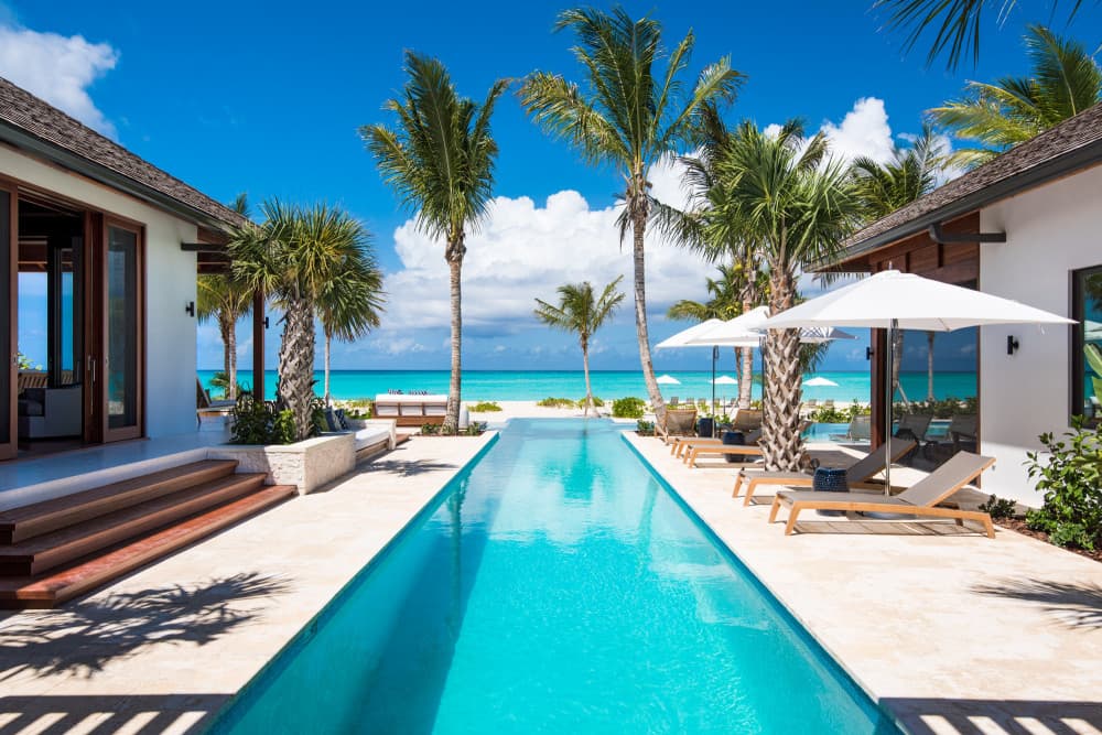 Hawksbill lap pool with palm trees and Caribbean views, Providenciales, Turks and Caicos Islands