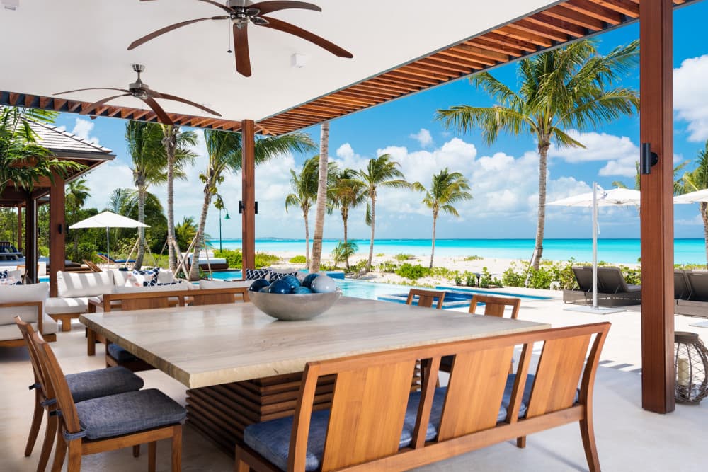 Hawksbill covered dining terrace overlooking infinity pool, Providenciales, Turks and Caicos Islands