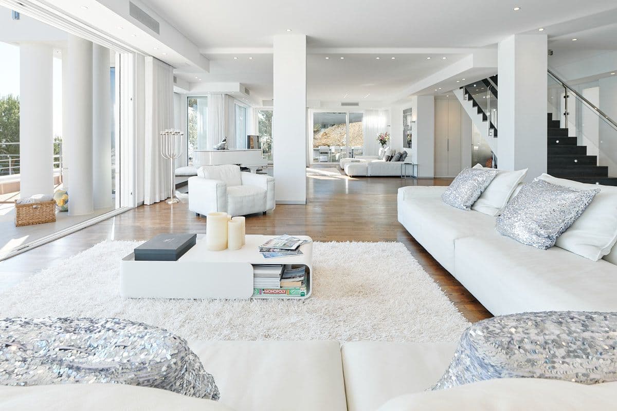 White living lounge beside the staircase with sea views at Blue Sea Bliss, Ibiza