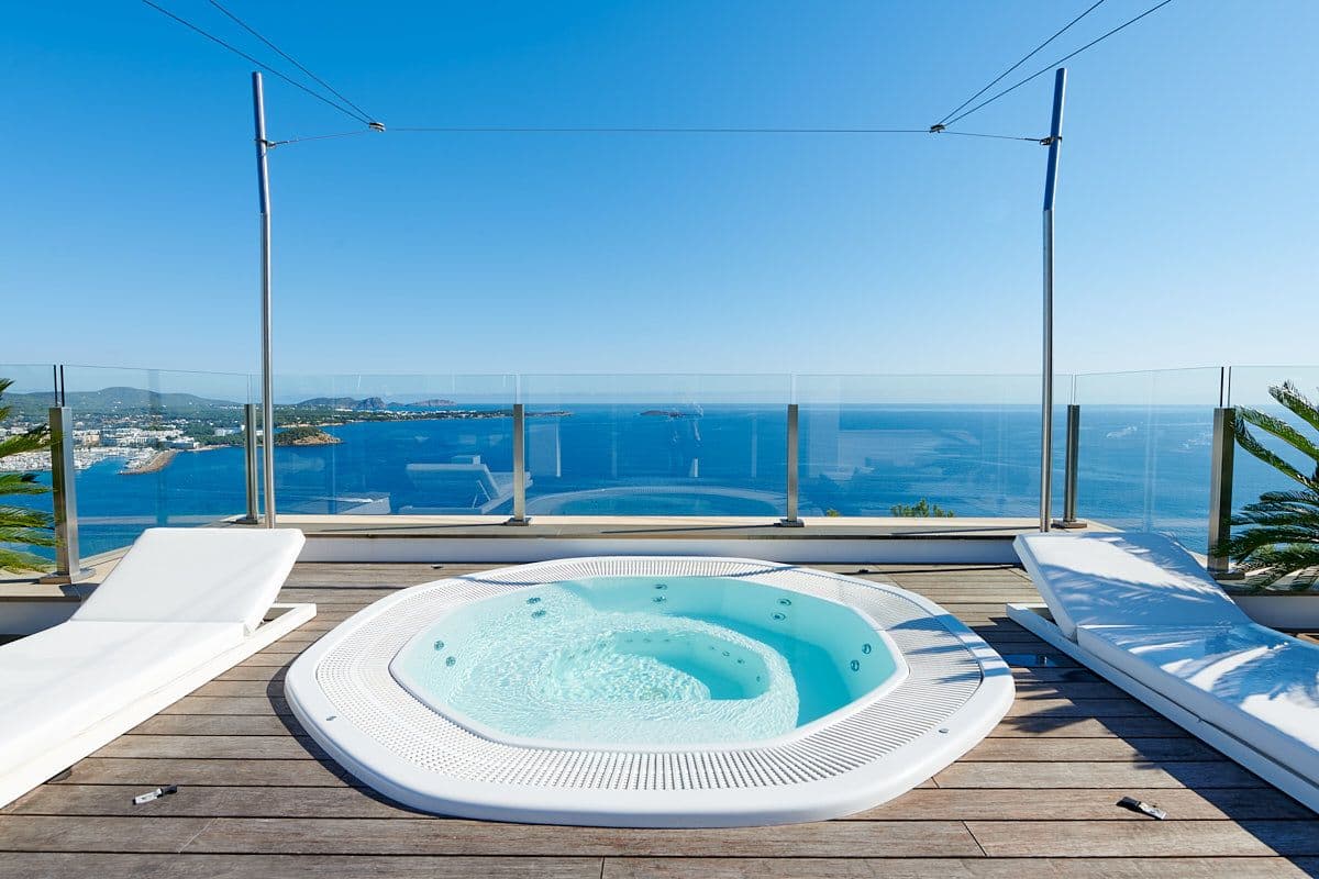 Rooftop jacuzzi with loungers and a panoramic sea view at Blue Sea Bliss, Ibiza
