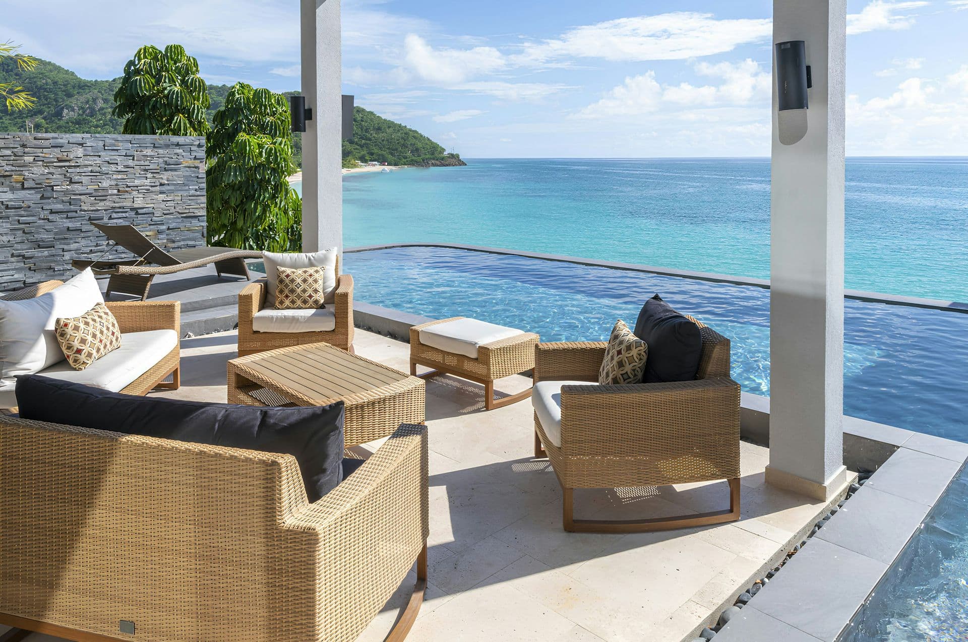Terrace lounge beside the infinity pool overlooking the turquoise bay at Life in Love, Antigua