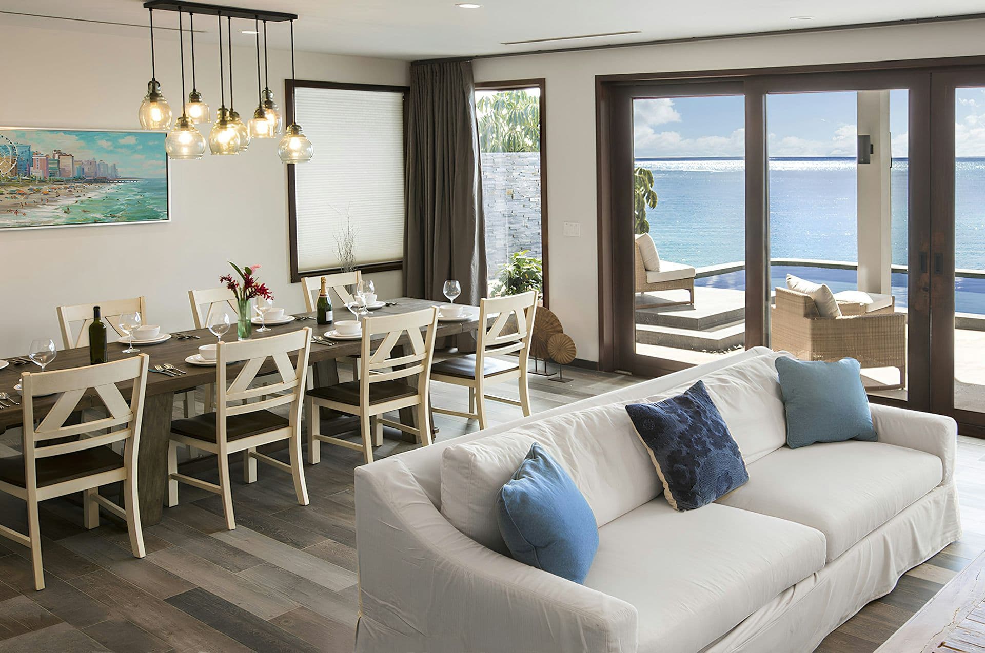 Open-plan living and dining room opening to the sea-view terrace at Life in Love
