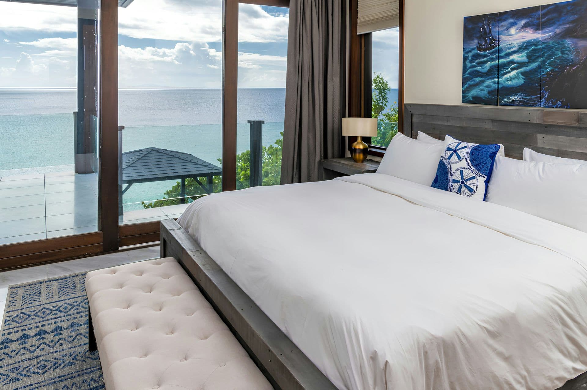 Master bedroom with a sea-view balcony at Life in Love, Antigua